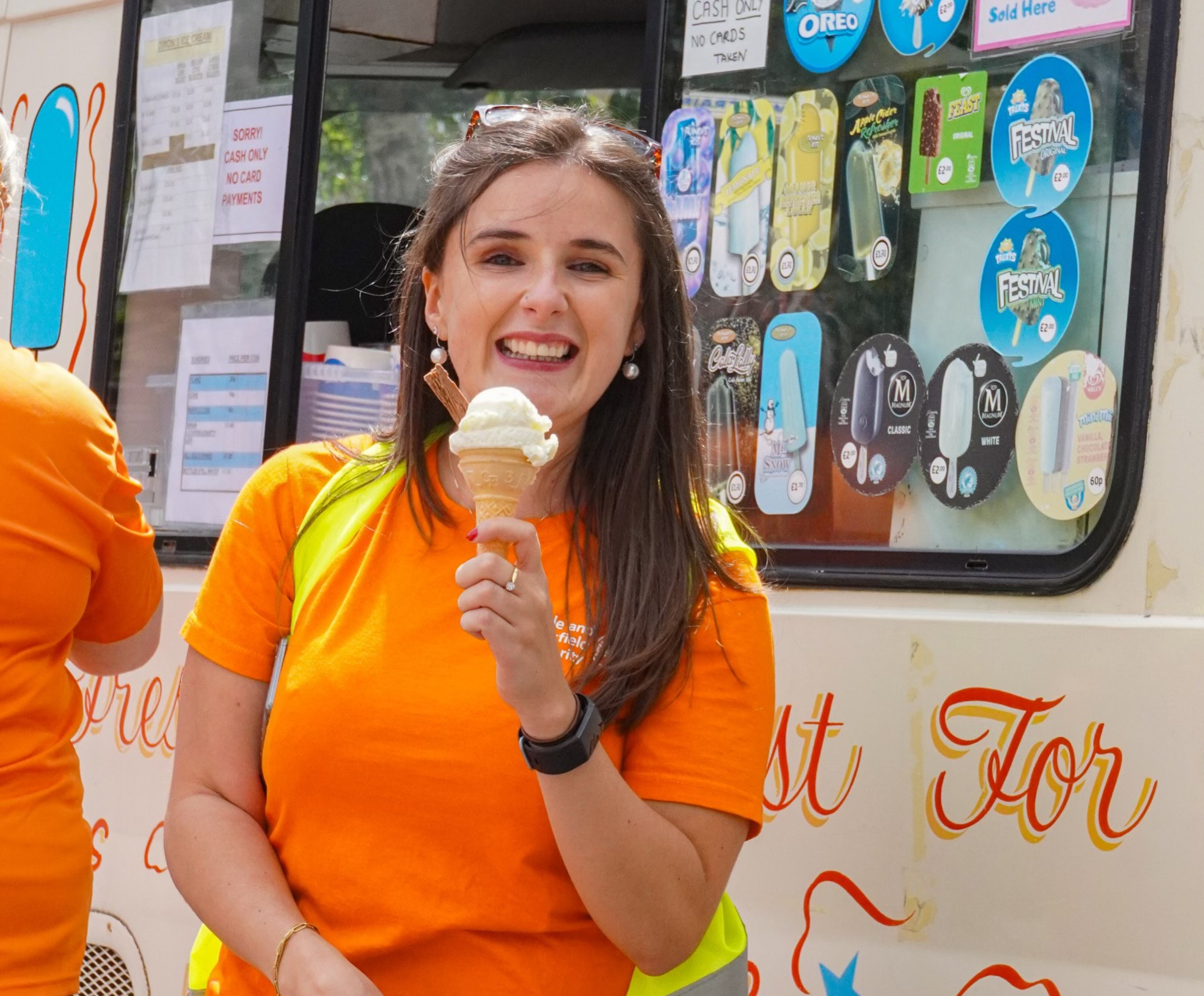 Fundraiser stood with ice cream after walking event.