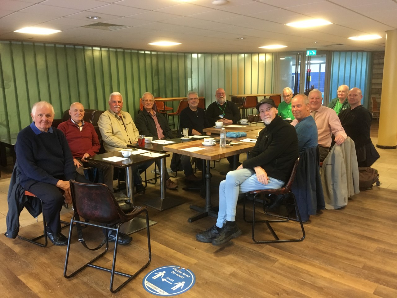 Group of men at cancer support meeting.