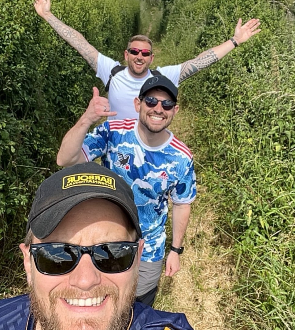 Three men on a walk.